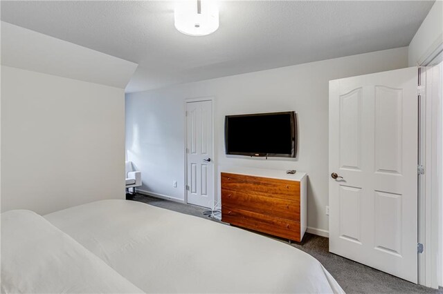 carpeted bedroom with baseboards