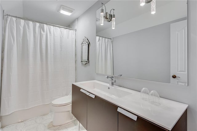 bathroom featuring shower / tub combo with curtain, toilet, and vanity