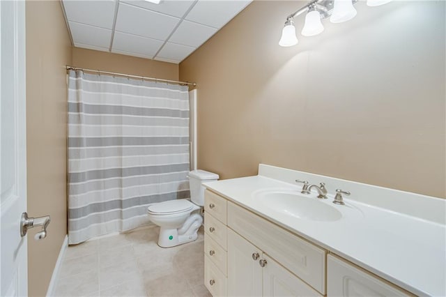 bathroom featuring tile patterned floors, toilet, baseboards, curtained shower, and vanity