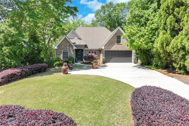 view of front facade with stone siding, driveway, and a front yard