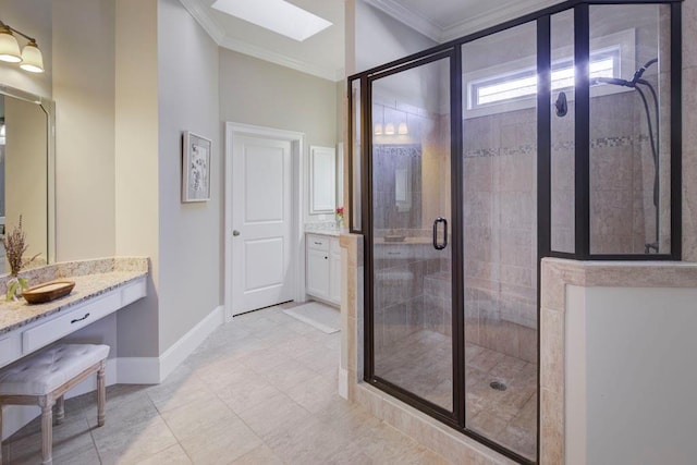 bathroom featuring vanity, a skylight, a shower with door, and crown molding