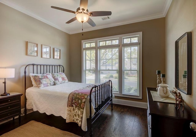 bedroom featuring ornamental molding, ceiling fan, and dark wood-type flooring