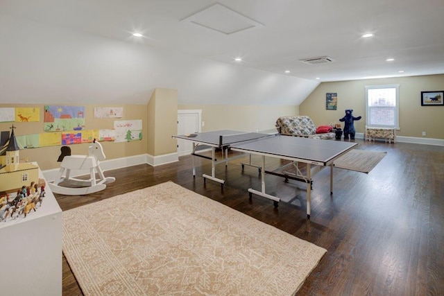 game room with lofted ceiling and dark wood-type flooring