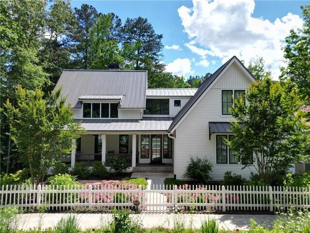 9229 Selborne Ln, Chattahoochee Hills, GA 30268 - view of front of property featuring a porch and a fenced front yard