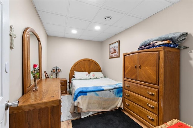 bedroom featuring recessed lighting and wood finished floors
