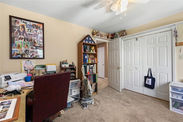 office with carpet floors, a textured ceiling, and ceiling fan