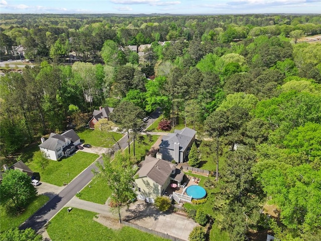aerial view featuring a wooded view