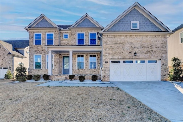 view of front of property featuring a porch and a garage