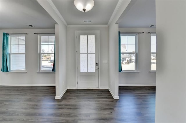 foyer featuring dark wood-type flooring and ornamental molding