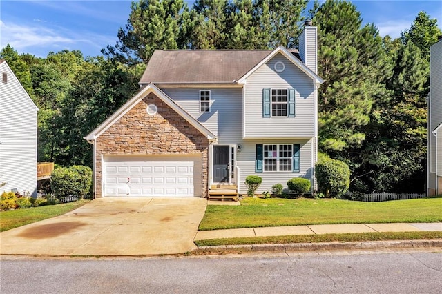 front of property with a front yard and a garage