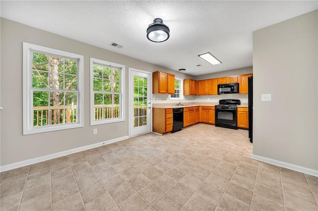 kitchen featuring sink and black appliances