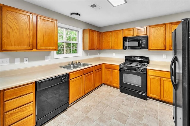 kitchen featuring sink and black appliances