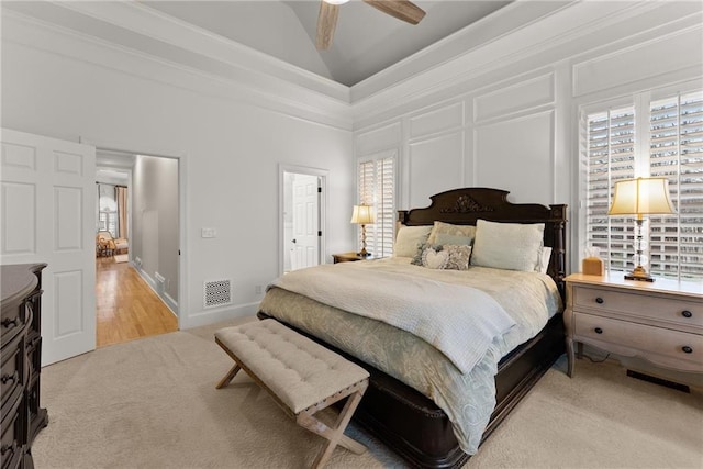 bedroom with ceiling fan, crown molding, high vaulted ceiling, and multiple windows