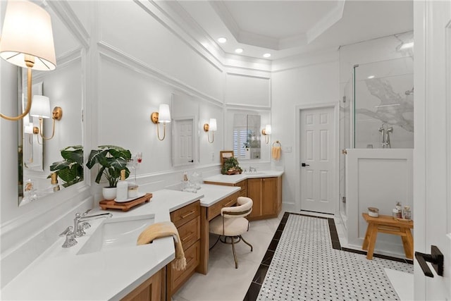 bathroom with tile patterned flooring, vanity, a tray ceiling, and an enclosed shower