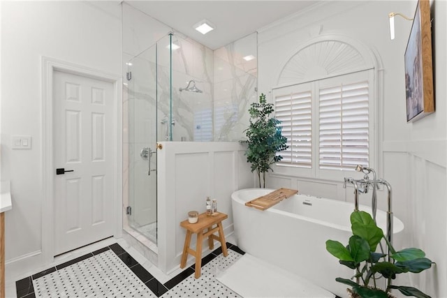 bathroom featuring tile patterned flooring and shower with separate bathtub