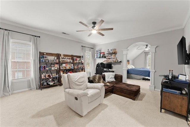 living room with ceiling fan, plenty of natural light, and light colored carpet