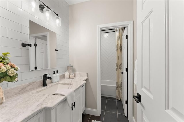 bathroom featuring tile patterned flooring, vanity, and shower / tub combo