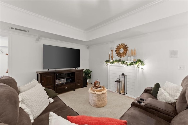 living room with carpet flooring, a raised ceiling, and ornamental molding