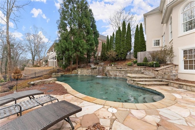 view of swimming pool featuring a patio area and pool water feature