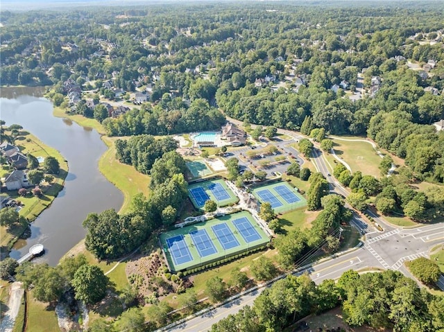 birds eye view of property with a water view