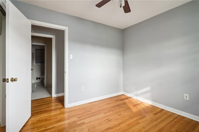 unfurnished room with ceiling fan and light hardwood / wood-style flooring