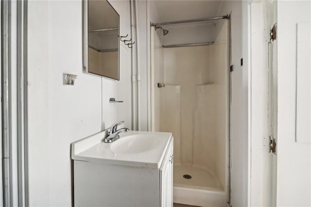 bathroom with a shower and vanity