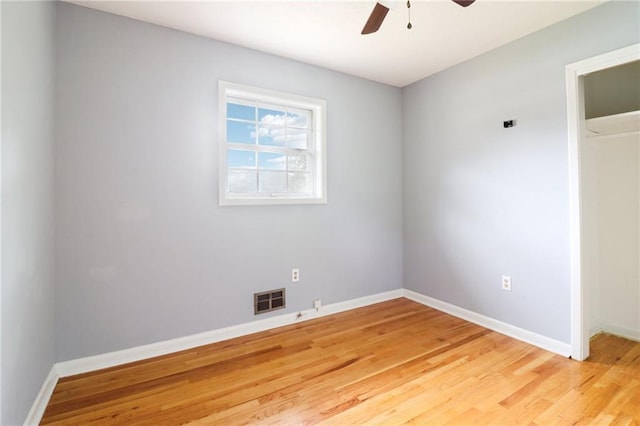 unfurnished room featuring ceiling fan and hardwood / wood-style flooring