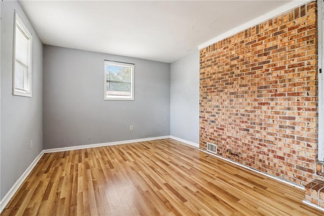 empty room with light hardwood / wood-style floors