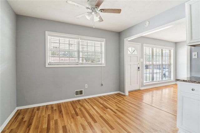 interior space featuring light wood-type flooring and ceiling fan