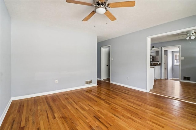 spare room featuring ceiling fan and light wood-type flooring