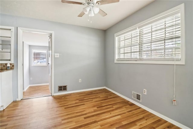 unfurnished room featuring ceiling fan and light hardwood / wood-style flooring