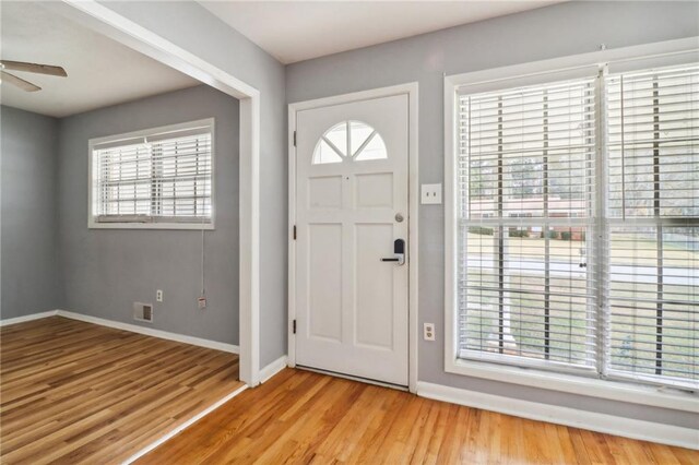 entrance foyer featuring light hardwood / wood-style flooring, a wealth of natural light, and ceiling fan