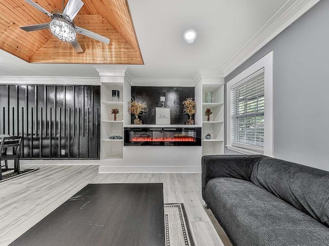 1564 Bubbling Creek Rd, Brookhaven, GA 30319 - living room with a glass covered fireplace, a raised ceiling, crown molding, and light wood finished floors