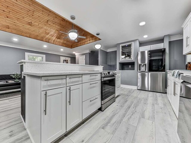 1564 Bubbling Creek Rd, Brookhaven, GA 30319 - kitchen with hanging light fixtures, a kitchen island, white cabinetry, and light countertops