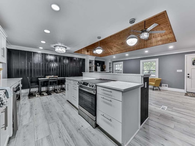 1564 Bubbling Creek Rd, Brookhaven, GA 30319 - kitchen with stainless steel range with electric cooktop, white cabinets, light countertops, ornamental molding, and hanging light fixtures