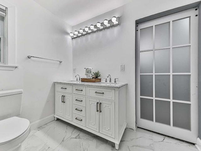 1564 Bubbling Creek Rd, Brookhaven, GA 30319 - full bath with toilet, marble finish floor, double vanity, and baseboards