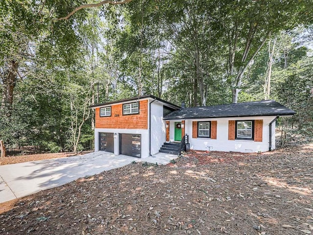 1564 Bubbling Creek Rd, Brookhaven, GA 30319 - split level home with driveway and an attached garage