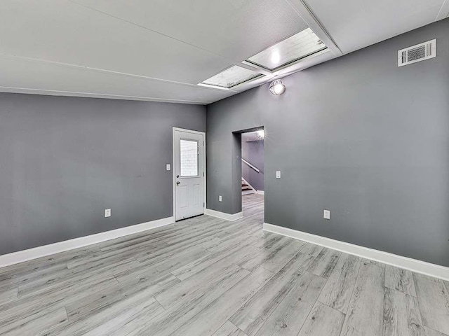 1564 Bubbling Creek Rd, Brookhaven, GA 30319 - unfurnished room featuring light wood-style floors, baseboards, stairs, and visible vents
