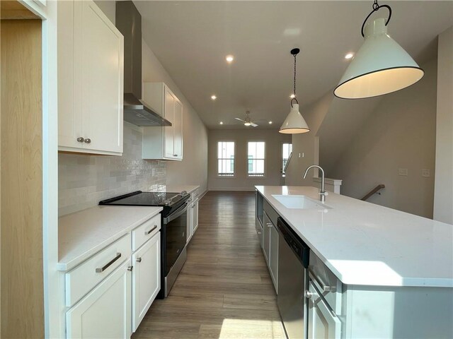 1427 Hazy Way Unit 310, Atlanta, GA 30315 - kitchen featuring a sink, black range with electric cooktop, dishwasher, wall chimney range hood, and backsplash