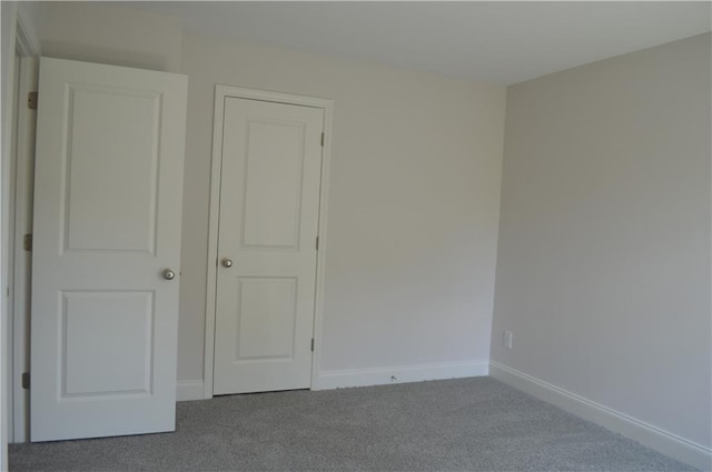 unfurnished bedroom with carpet floors