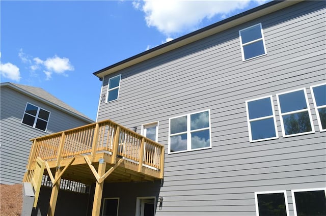 rear view of house with a wooden deck