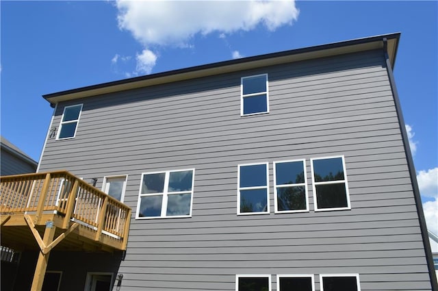 rear view of house featuring a deck