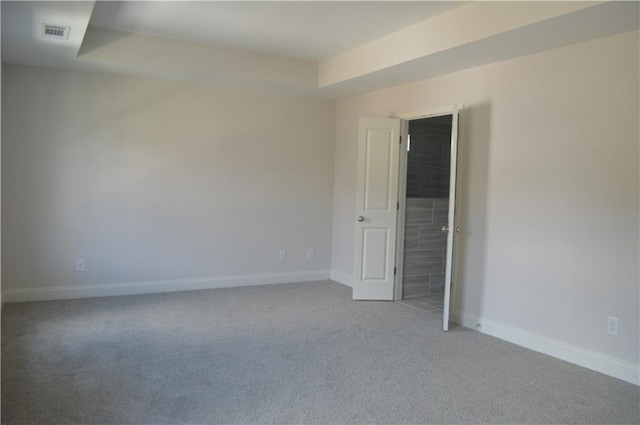 spare room with light colored carpet