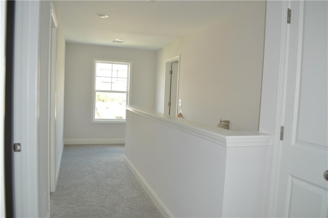 hallway with light carpet