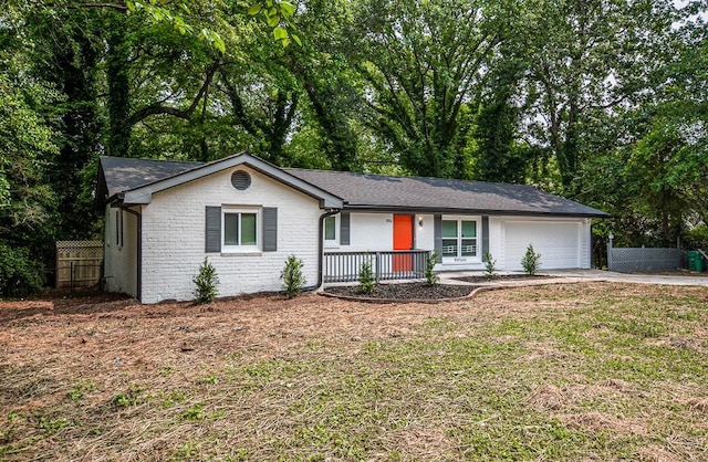 5640 Redan Cir, Stone Mountain, GA 30088 - single story home featuring a porch, an attached garage, concrete driveway, and brick siding