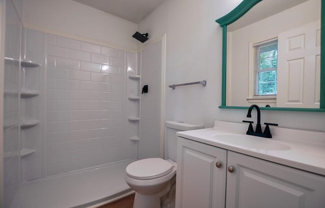 5640 Redan Cir, Stone Mountain, GA 30088 - bathroom with vanity, toilet, and tiled shower