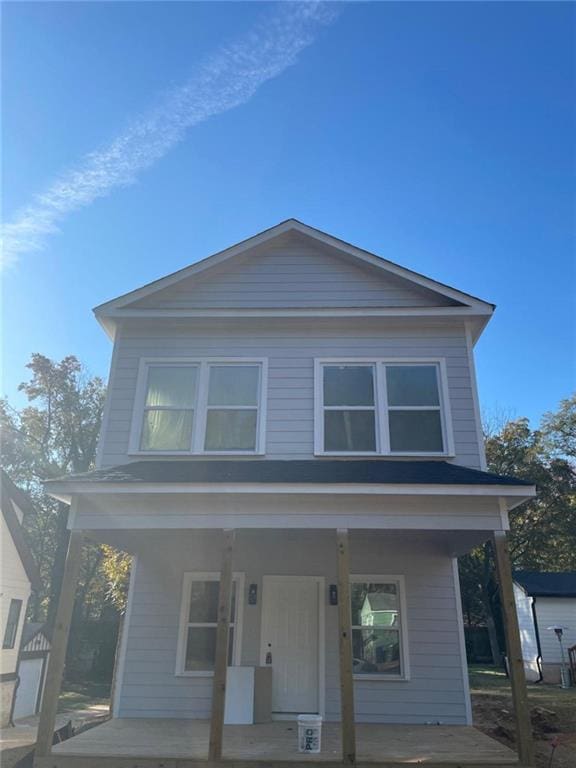 view of front of home featuring an outdoor structure and a porch