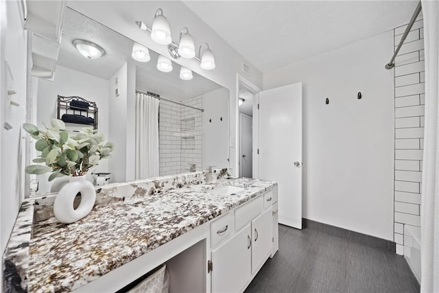 bathroom with vanity and walk in shower