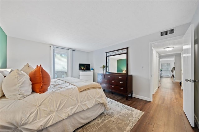 bedroom featuring hardwood / wood-style flooring