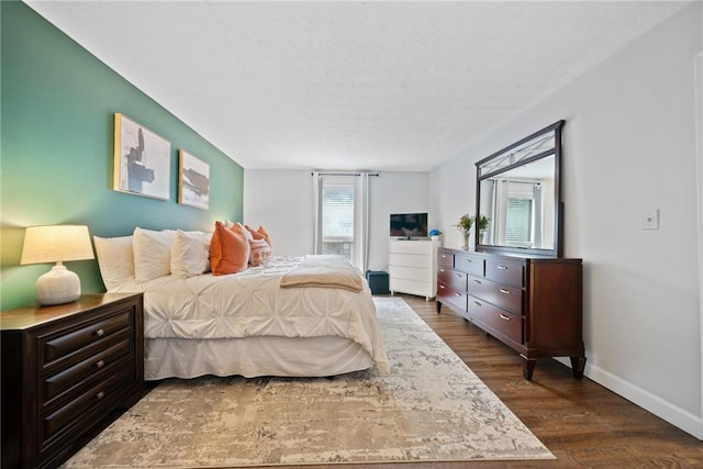 bedroom with dark wood-type flooring